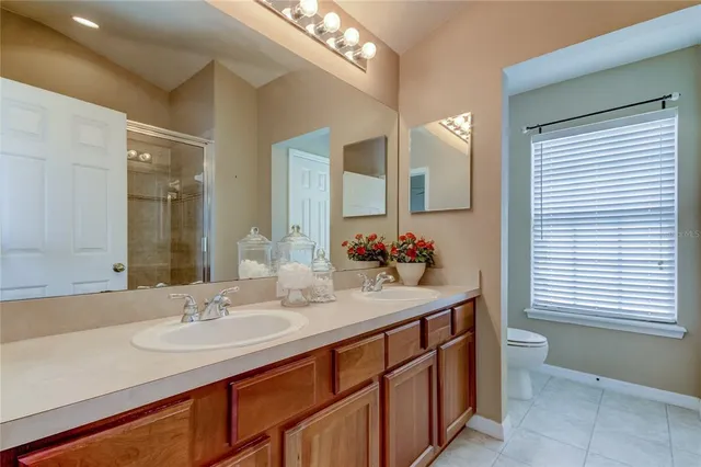 a bathroom with a glass shower door