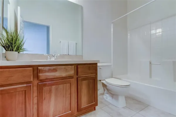 a view of a house with backyard and garden