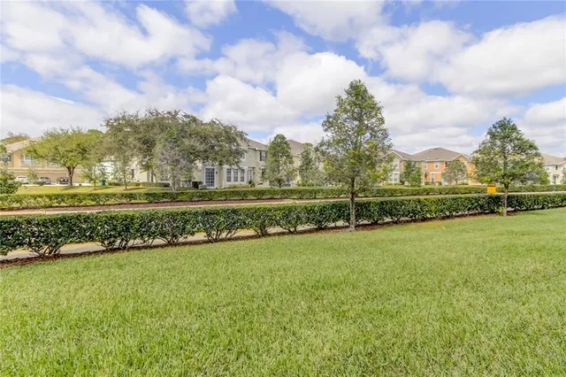 a view of a lake with houses in the back