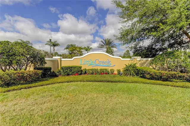 a view of a swimming pool with a yard