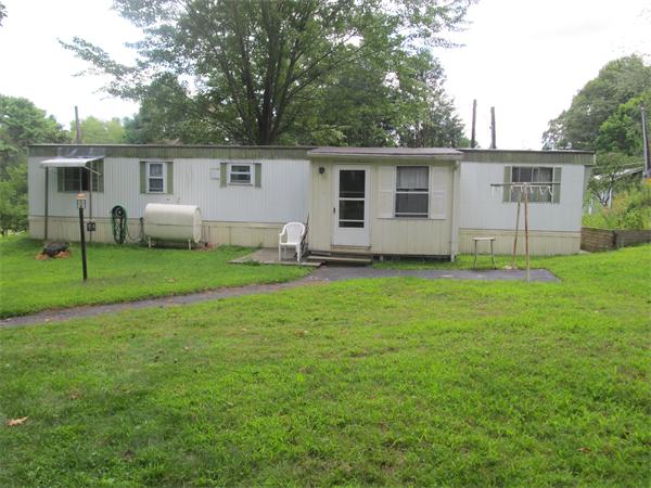 59 Gauthier Road Barre, MA 01005 - Photo 1 of 1 front view of a house and a yard