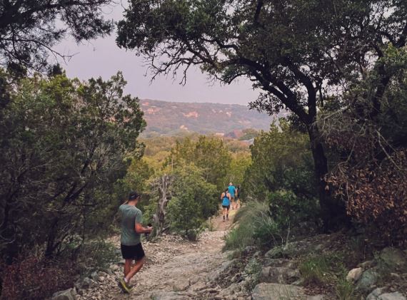 2950 Lantana Ridge Drive Austin, TX 78732 - Photo 33 of 40 a backyard of a house with lots of green space