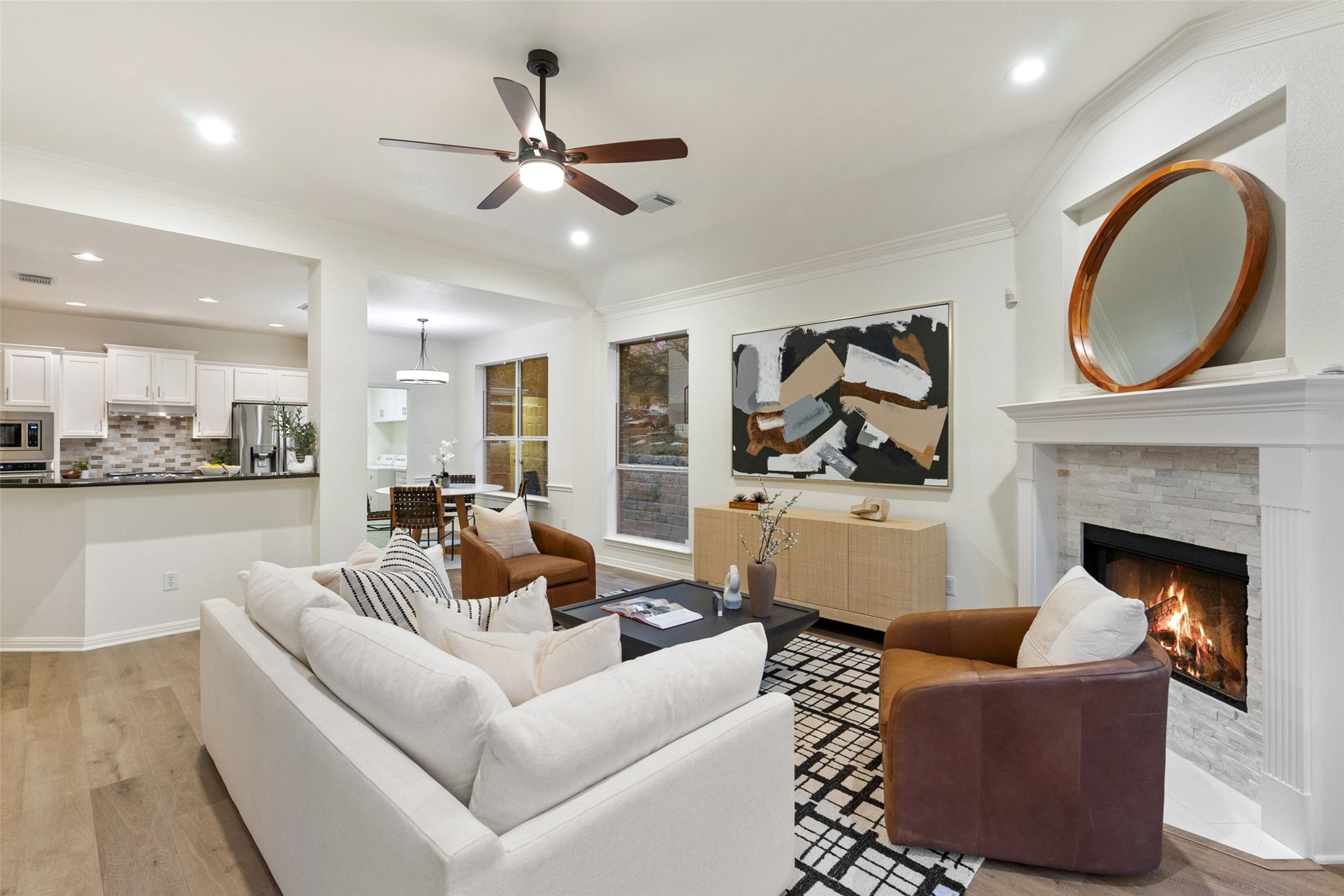2950 Lantana Ridge Drive Austin, TX 78732 - Photo 10 of 40 a living room with furniture and a fireplace