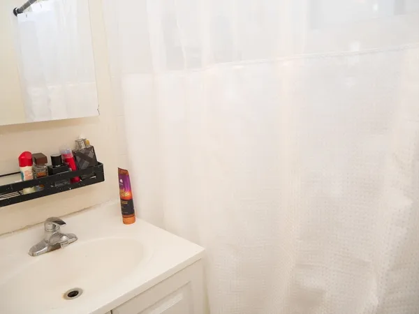 a bathroom with a sink and a white vanity