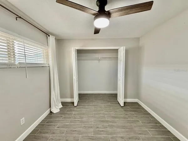 a view of an empty room with a window