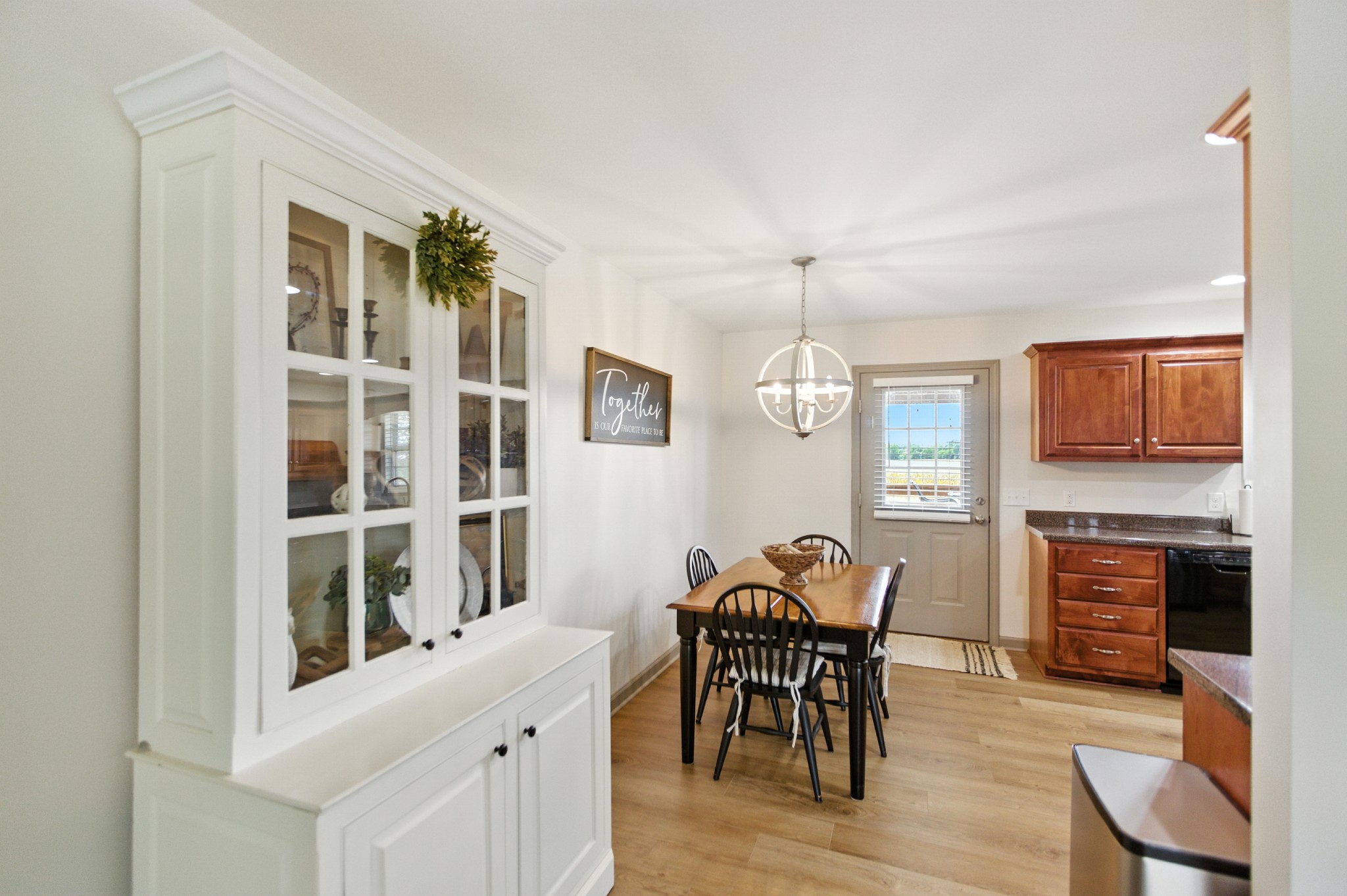 6411 Spring Creek Road Tullahoma, TN 37388 - Photo 16 of 57 a view of a dining room with furniture window and wooden floor