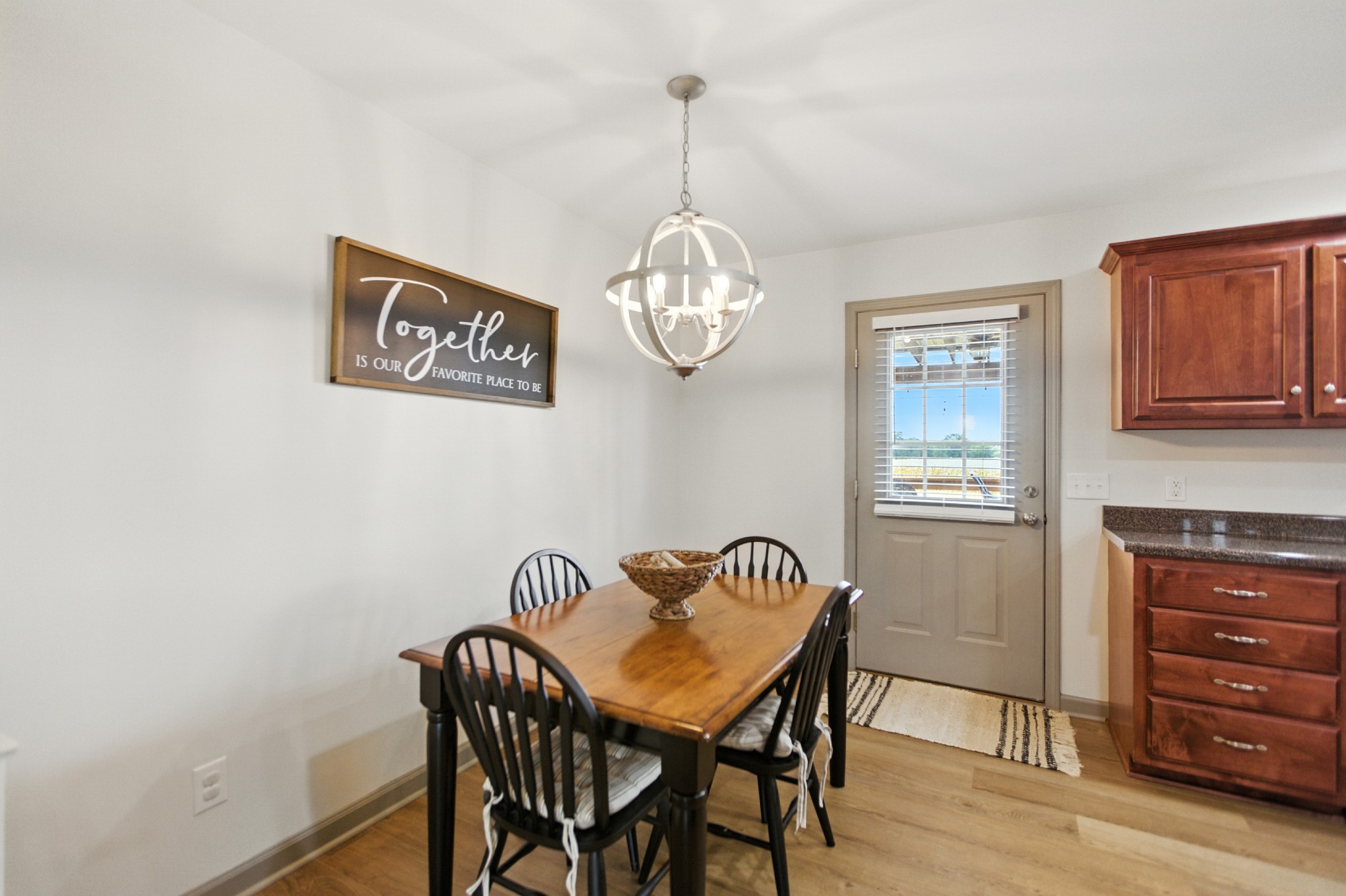 6411 Spring Creek Road Tullahoma, TN 37388 - Photo 17 of 57 a view of a dining room with furniture window and wooden floor