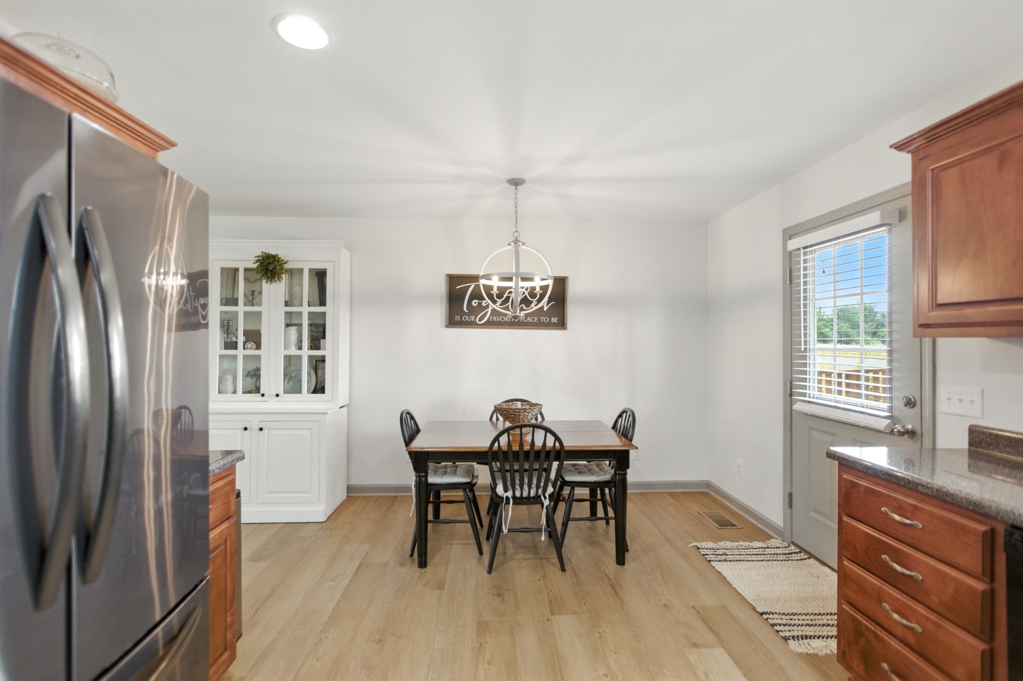 6411 Spring Creek Road Tullahoma, TN 37388 - Photo 19 of 57 a view of a dining room with furniture window and wooden floor