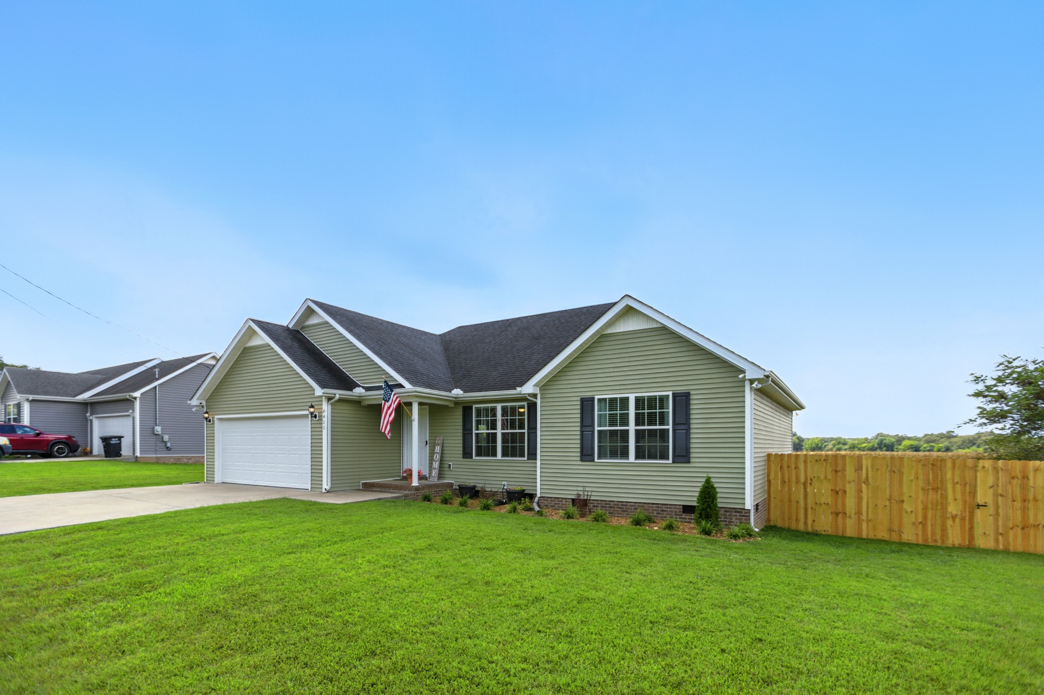 6411 Spring Creek Road Tullahoma, TN 37388 - Photo 3 of 57 a view of a yard in front of a house with large trees