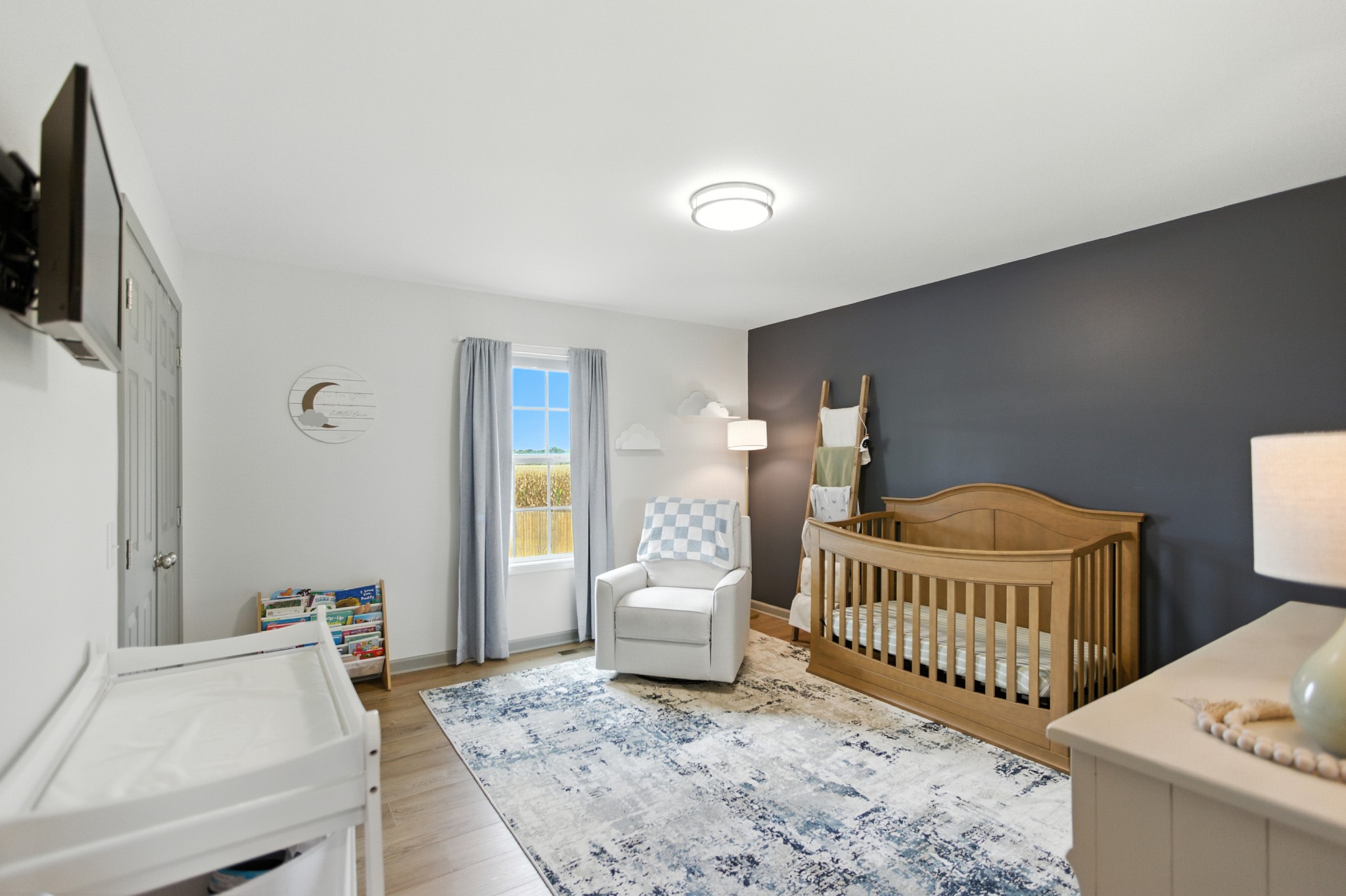 6411 Spring Creek Road Tullahoma, TN 37388 - Photo 32 of 57 a bedroom with furniture and a window