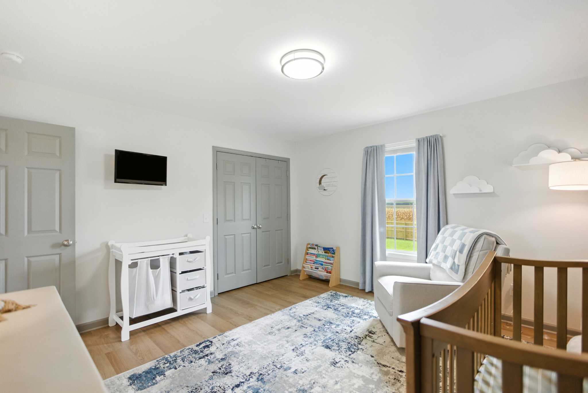 6411 Spring Creek Road Tullahoma, TN 37388 - Photo 33 of 57 a living room with furniture and a flat screen tv