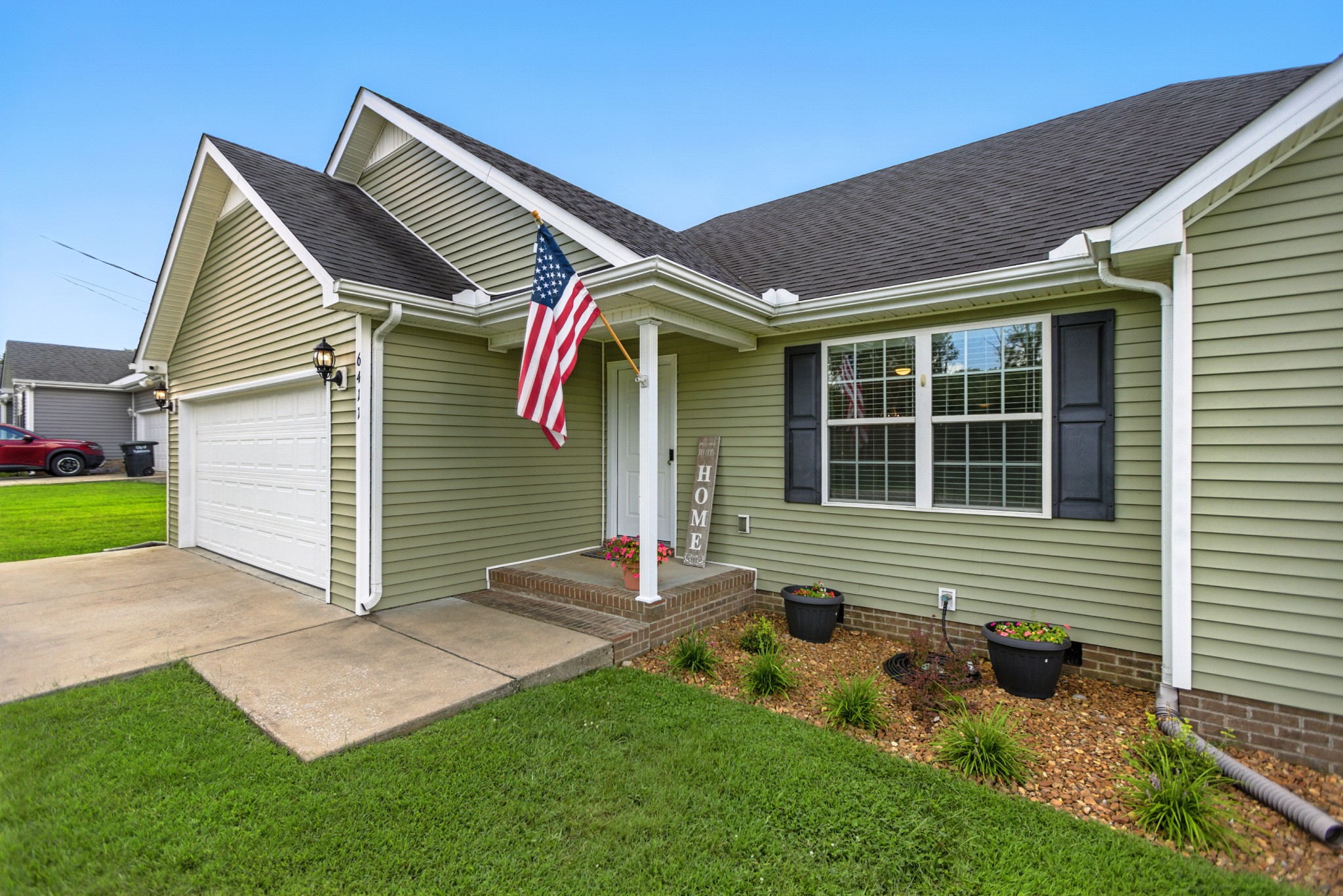 6411 Spring Creek Road Tullahoma, TN 37388 - Photo 10 of 57 a front view of a house with a yard