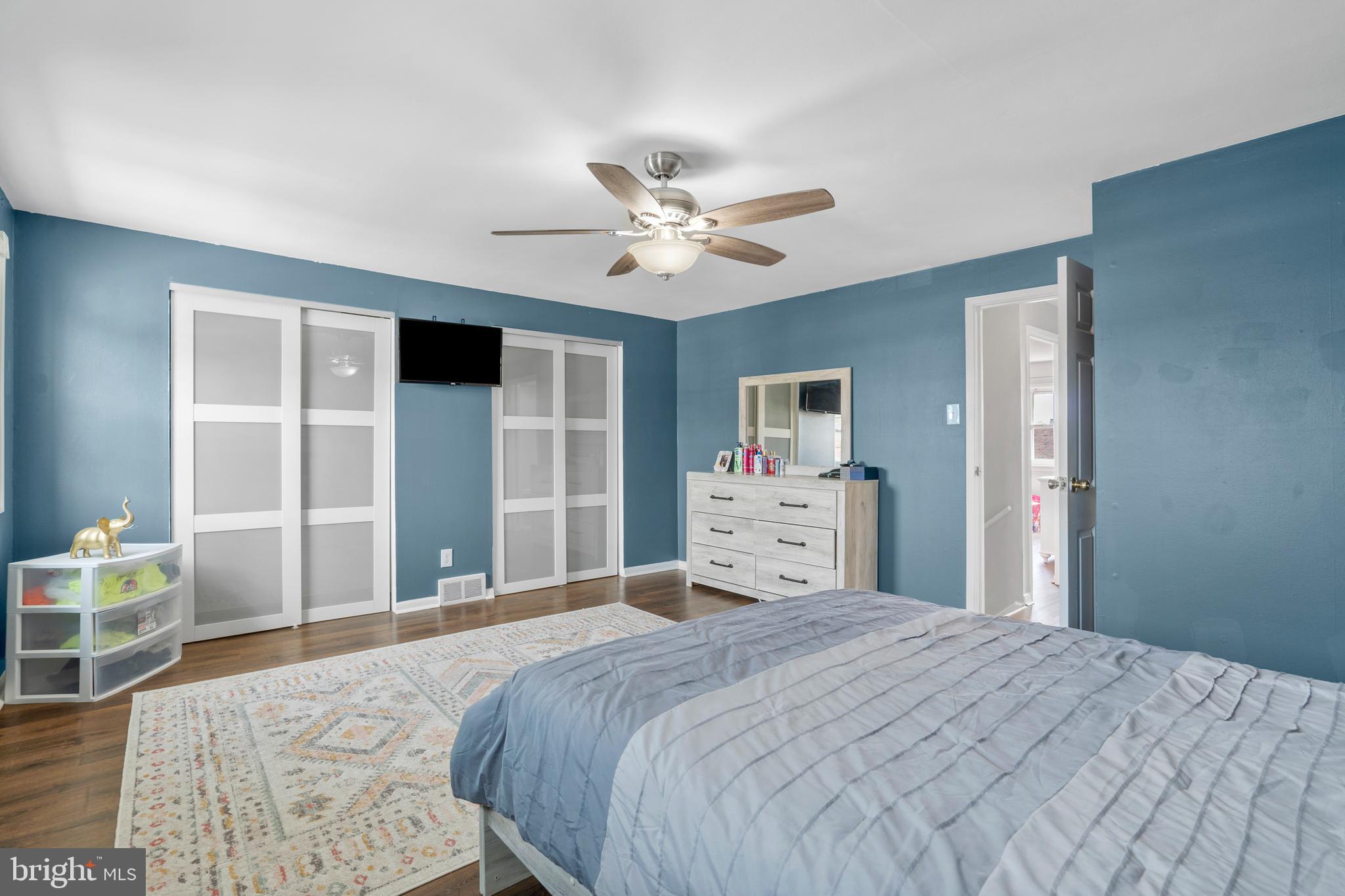 12413 Dunks Ferry Road Philadelphia, PA 19154 - Photo 17 of 35 a bedroom with a large bed and dresser with mirror