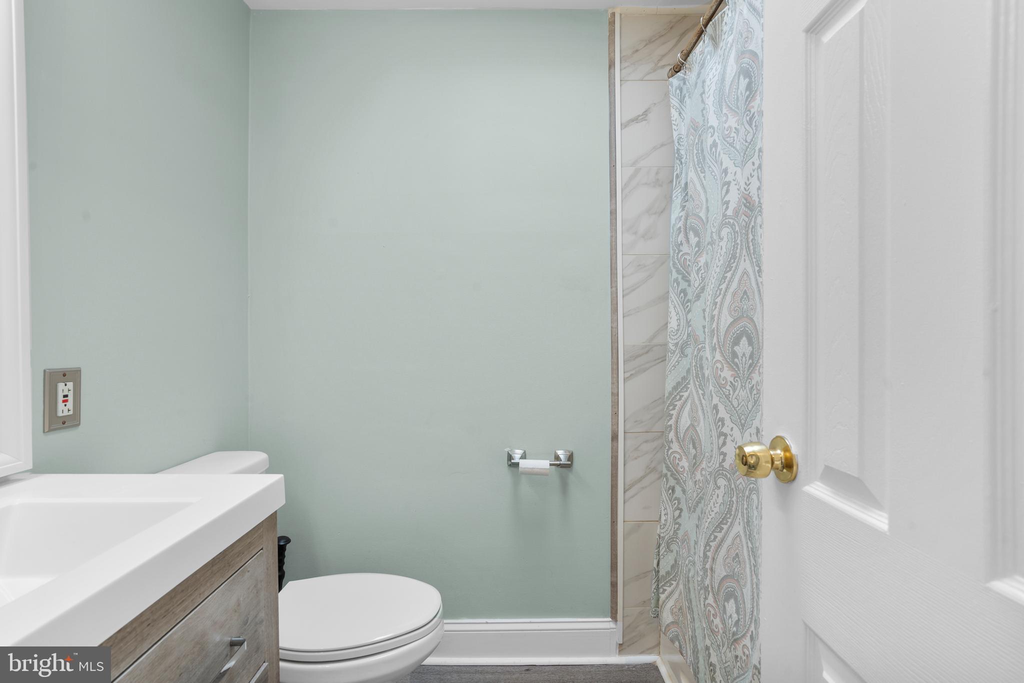 12413 Dunks Ferry Road Philadelphia, PA 19154 - Photo 18 of 35 a white toilet sitting next to a white tub