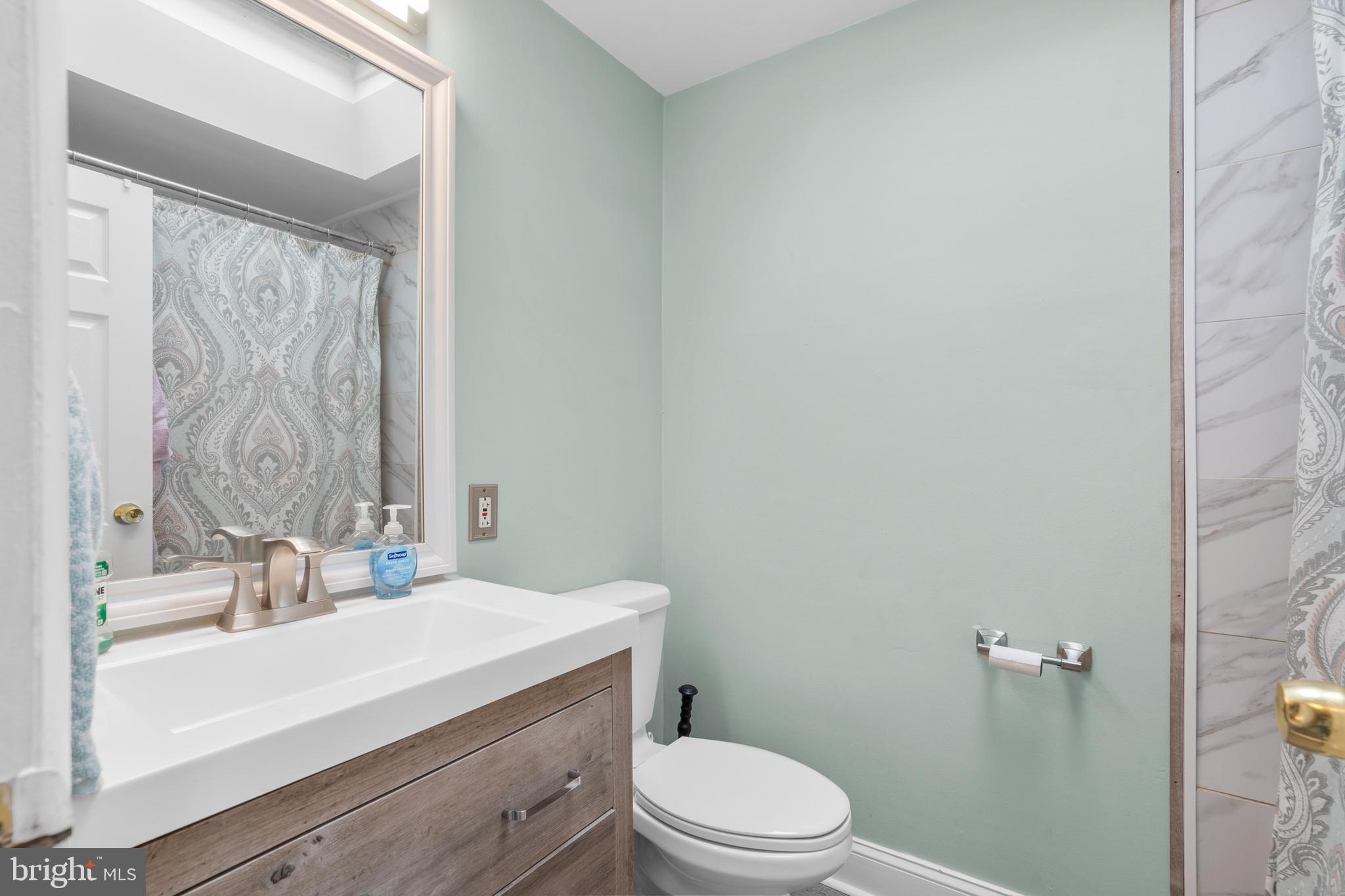 12413 Dunks Ferry Road Philadelphia, PA 19154 - Photo 19 of 35 a bathroom with a sink a toilet and shower