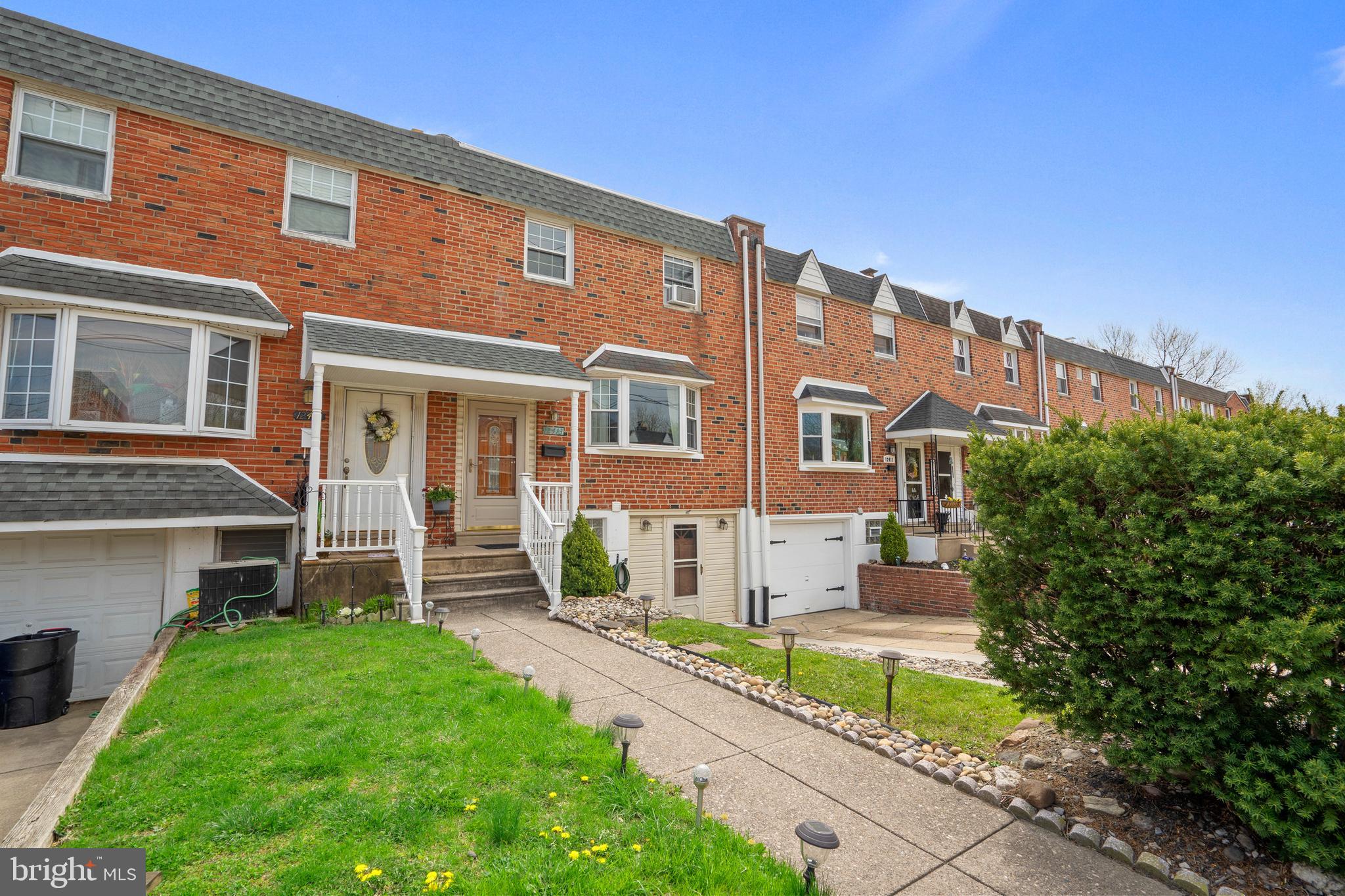 12413 Dunks Ferry Road Philadelphia, PA 19154 - Photo 2 of 35 a front view of a house with a yard