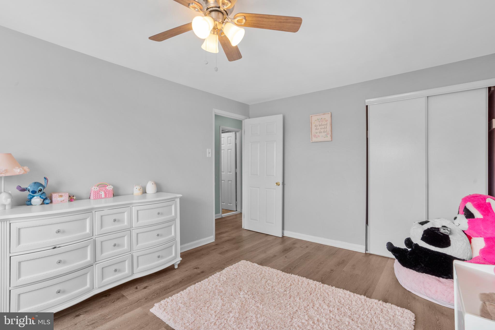 12413 Dunks Ferry Road Philadelphia, PA 19154 - Photo 23 of 35 a bedroom with a bed and a chandelier