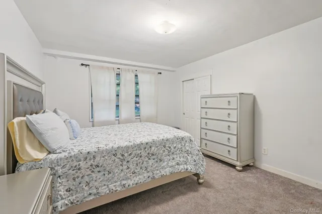 a bedroom with a bed and a cabinets