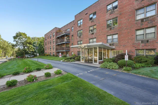 a view of a building with a yard