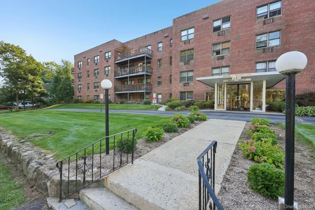 a view of a building with a yard