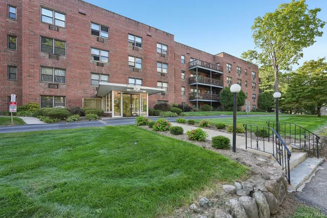 a view of a building with a yard