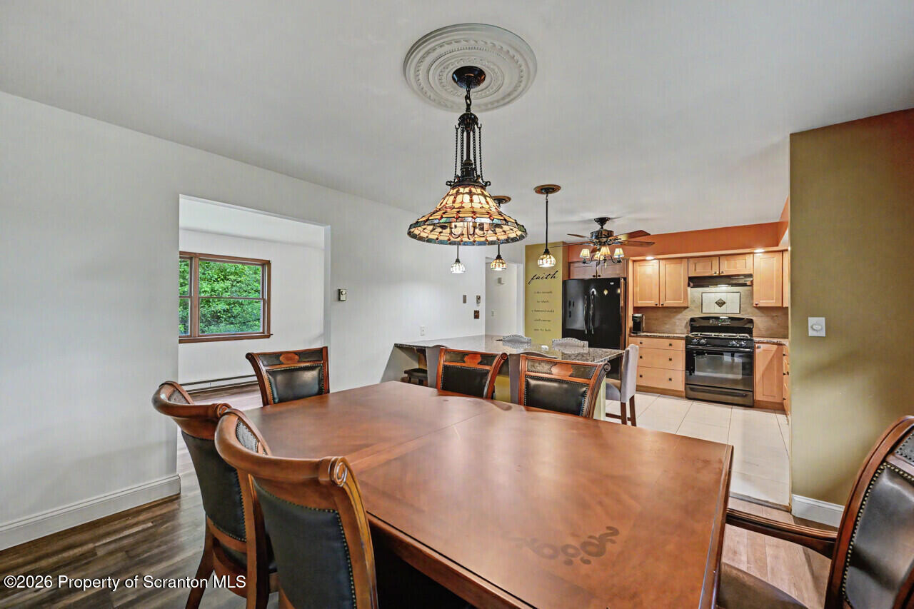 211 Buckingham Street Moscow, PA 18444 - Photo 23 of 83 a view of a dining room with furniture and wooden floor