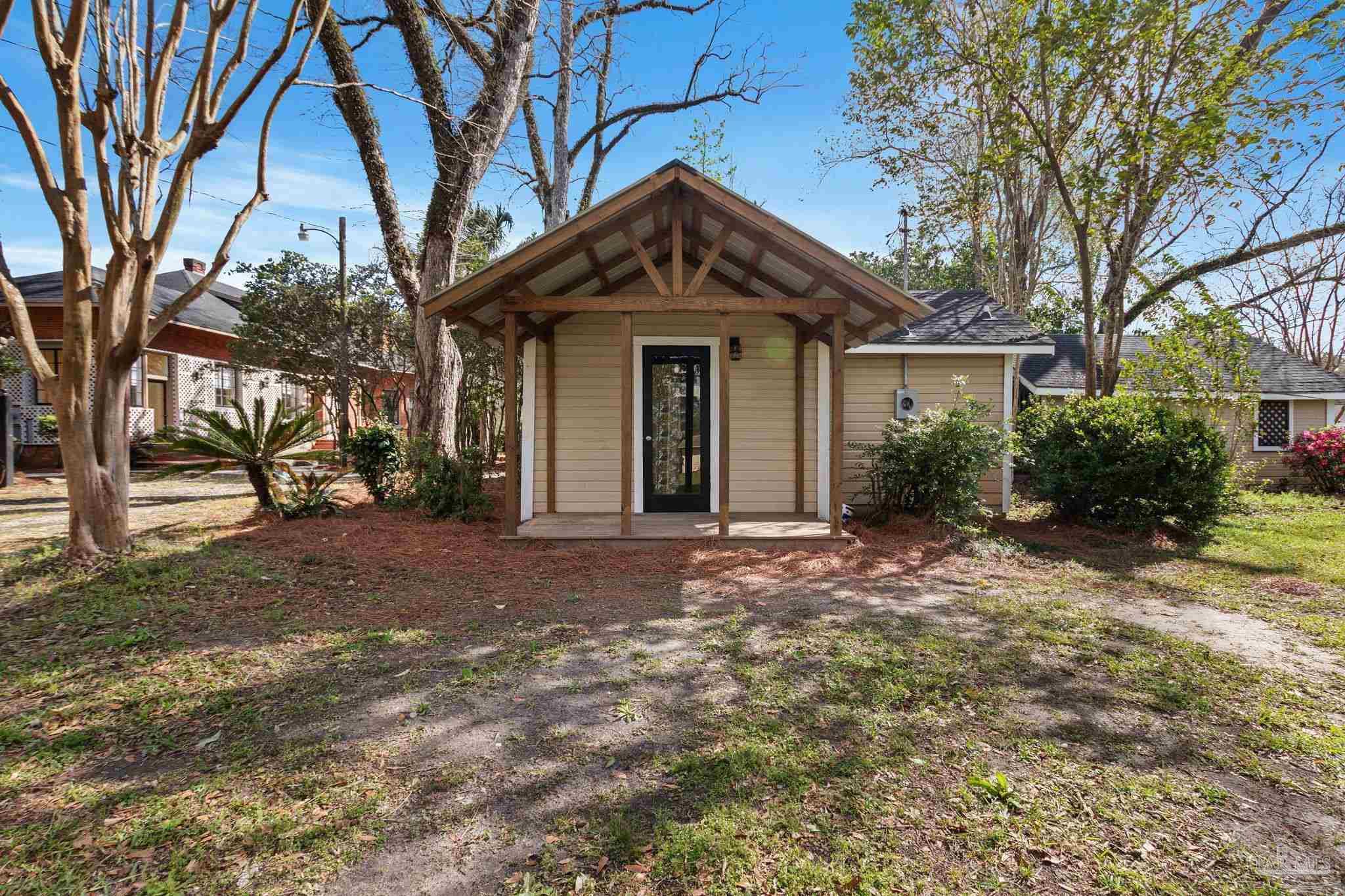 1701 Sowell Road Brewton, AL 36426 - Photo 72 of 72 a view of a house with a yard and large trees