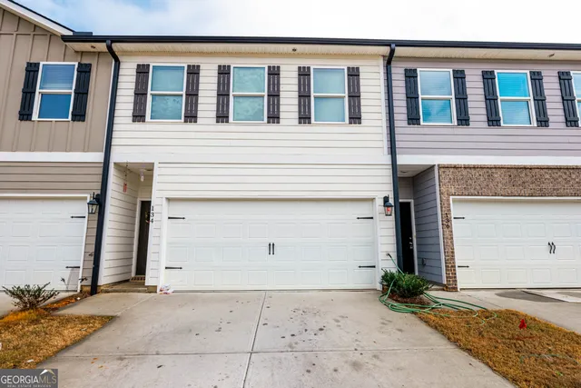 a view of a house with parking space