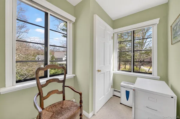a room with a bed and a window