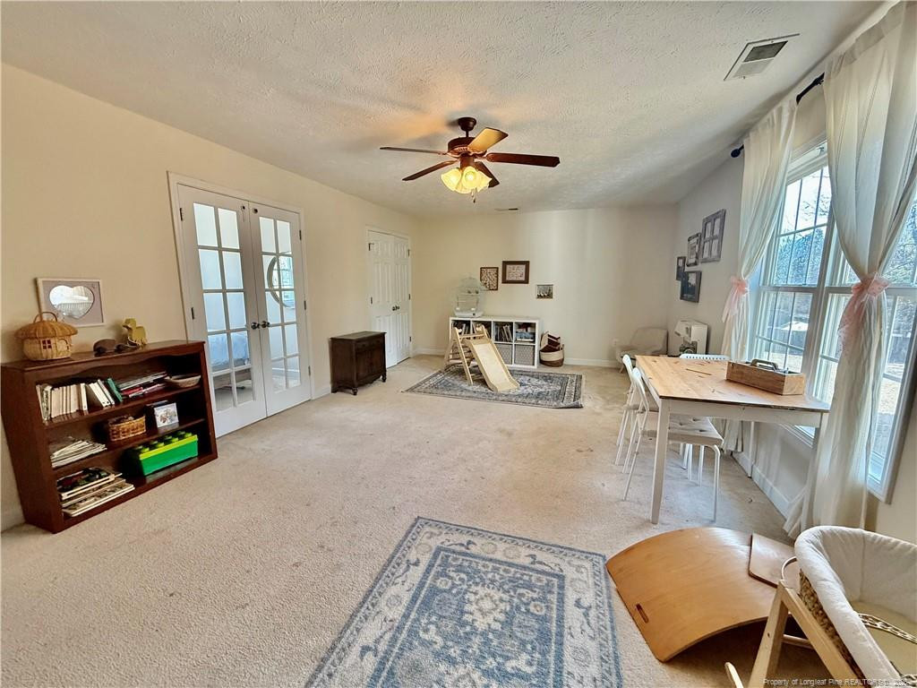 234 Pender Road Spring Lake, NC 28390 - Photo 22 of 39 a living room with furniture and wooden floor