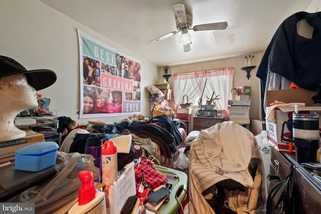 a living room with lots of furniture and a chandelier