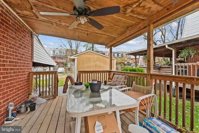 a balcony with furniture and wooden floor