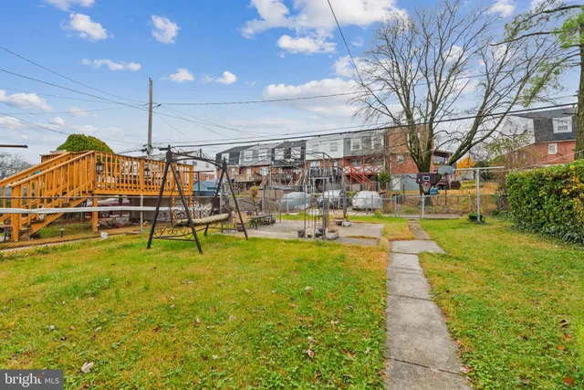 a swimming pool with yard and outdoor seating