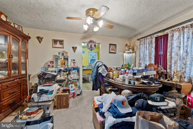 a room with gym equipment and a chandelier