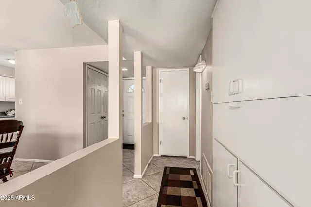 a view of a bathroom with sink and mirror