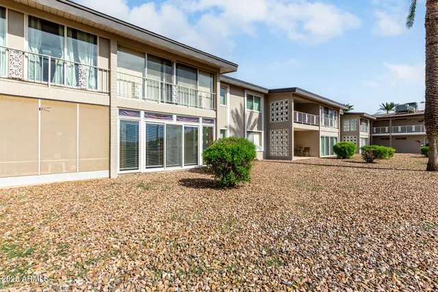 a view of a golf course with a lake