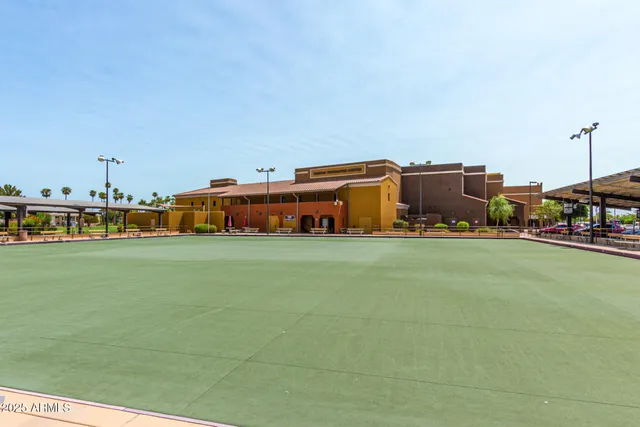 a balcony with table and chairs