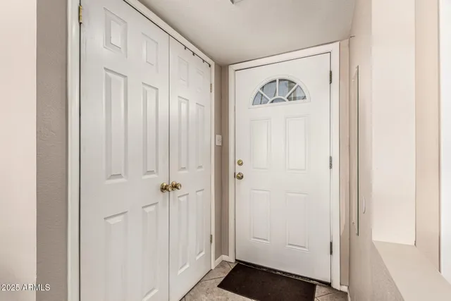 a view of a hallway with front door