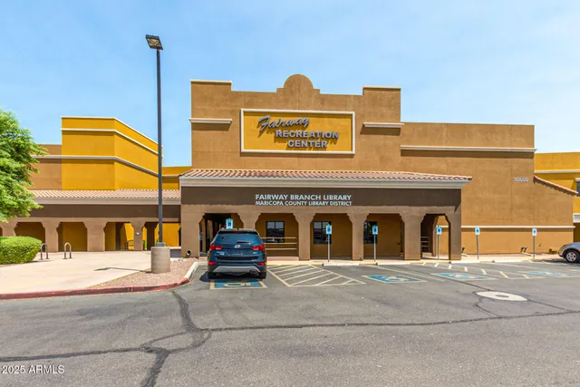 a view of a bench in front of a building