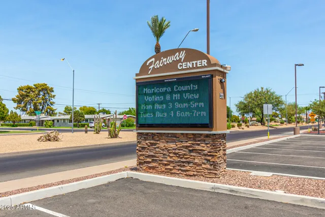a view of a golf course with a lake view