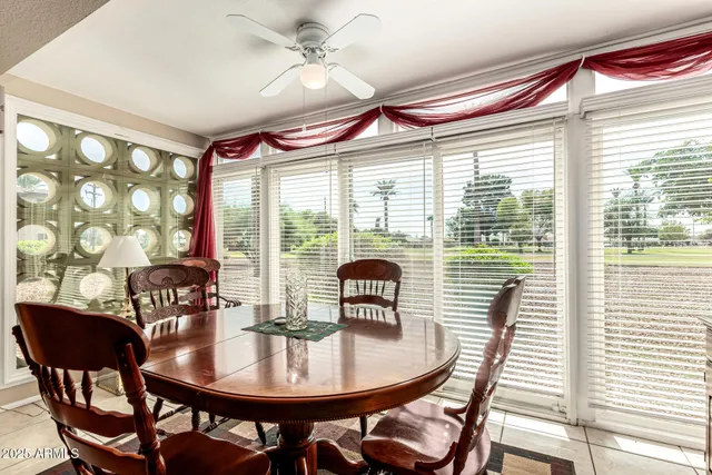 a view of a dining room with furniture and window