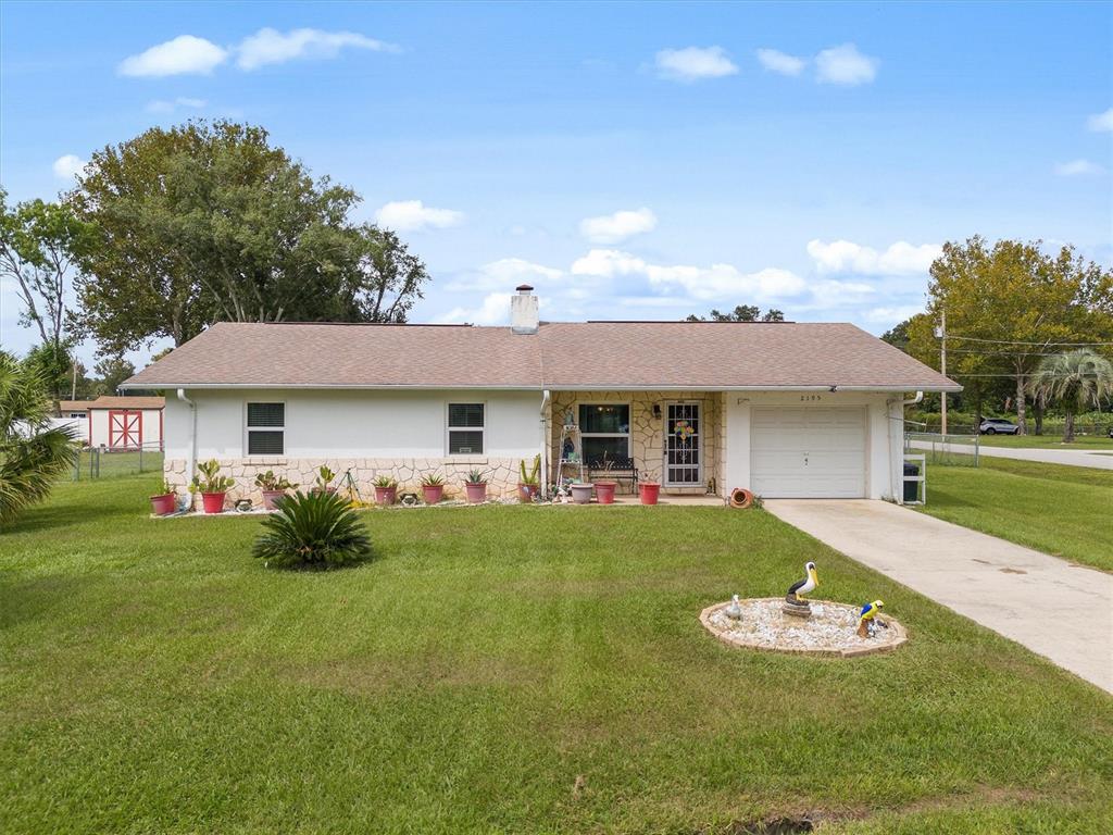 2195 Northeast 55th Street Ocala, FL 34479 - Photo 1 of 1 a front view of a house with garden