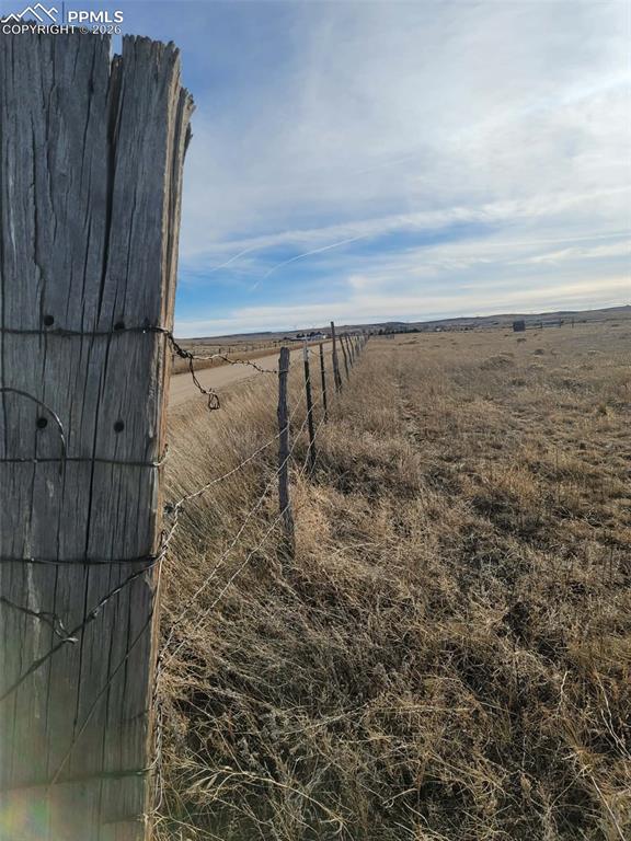 15530 Kanuch Road Calhan, CO 80808 - Photo 4 of 23 a view of a dry yard with wooden fence
