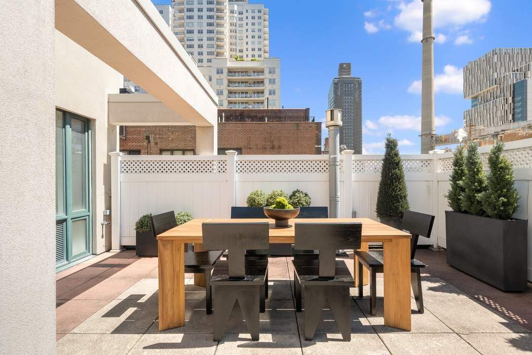 435 East 76th Street, Unit PHB Manhattan, NY 10021 - Photo 14 of 28 a view of a patio with a table and chairs and potted plants
