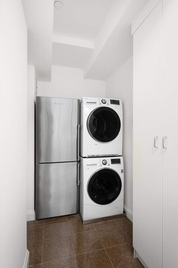 435 East 76th Street, Unit PHB Manhattan, NY 10021 - Photo 27 of 28 a utility room with dryer and washer