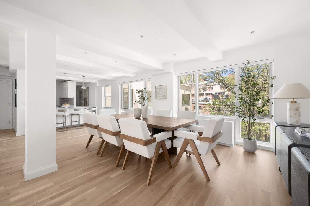 435 East 76th Street, Unit PHB Manhattan, NY 10021 - Photo 3 of 28 a dining room with furniture and wooden floor