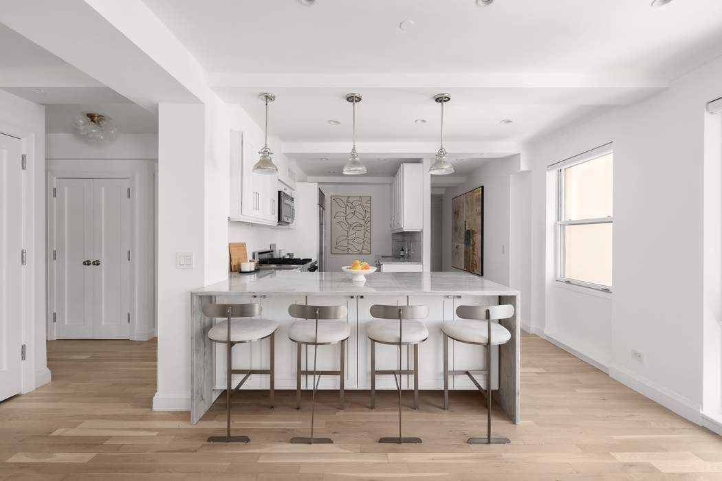 435 East 76th Street, Unit PHB Manhattan, NY 10021 - Photo 4 of 28 a view of a dining room with furniture and wooden floor