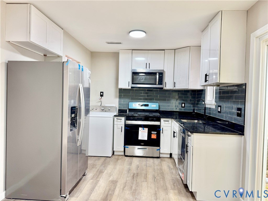 403 Roxana Road Henrico, VA 23075 - Photo 8 of 42 Kitchen featuring stainless steel appliances, dark