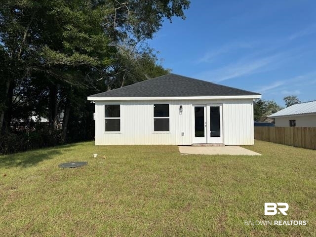 22203 6th Street Silverhill, AL 36576 - Photo 4 of 21 Rear view of house with a lawn, a patio area, roof with shingles, and french doors