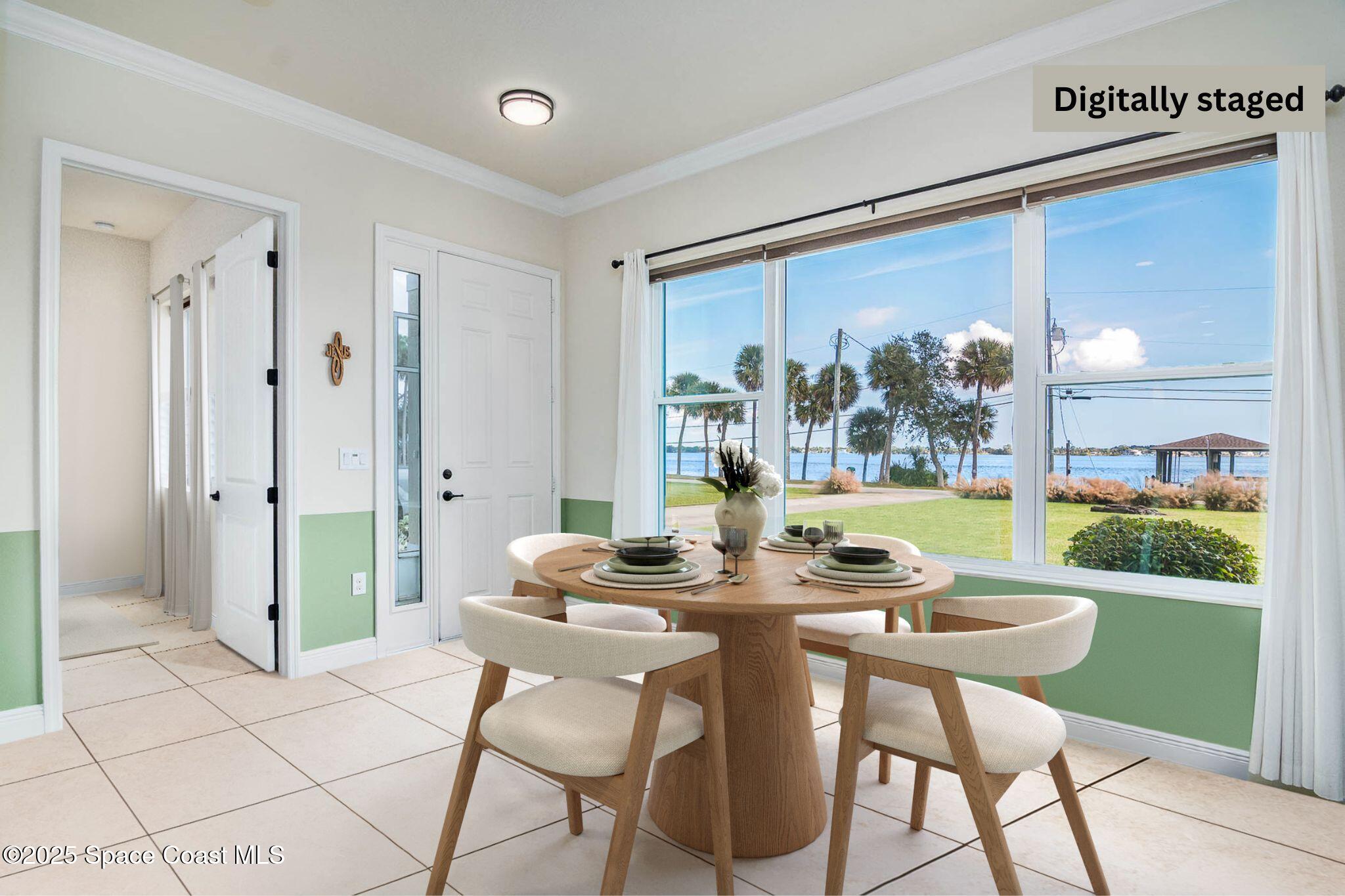 1953 Rockledge Drive Rockledge, FL 32955 - Photo 12 of 83 a dining room with furniture and a floor to ceiling window